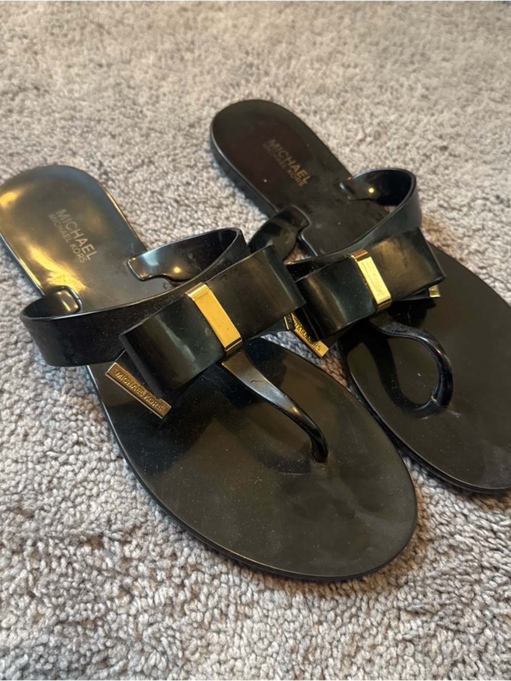 Michael Kors Black Bow Thong Sandals with Gold Plaque